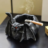 Cendrier chauve-souris et son mégot