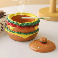 Cendrier cheeseburger ouvert avec un mégot