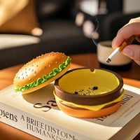 Cendrier hamburger avec un mégot et des cendres