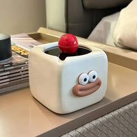 Cendrier mignon blanc sur une table
